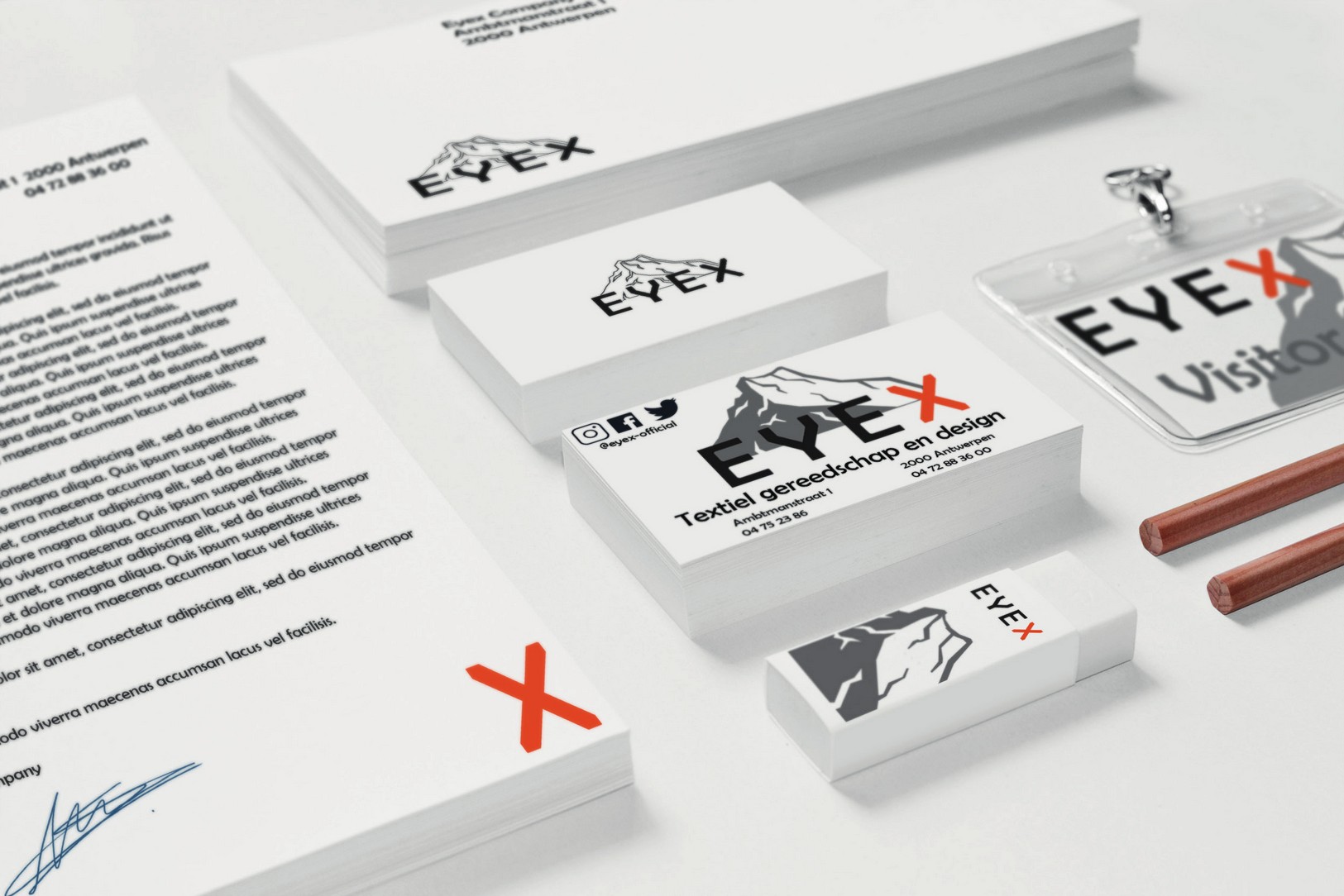 Eyex brand applied across stationery, business cards and badges.