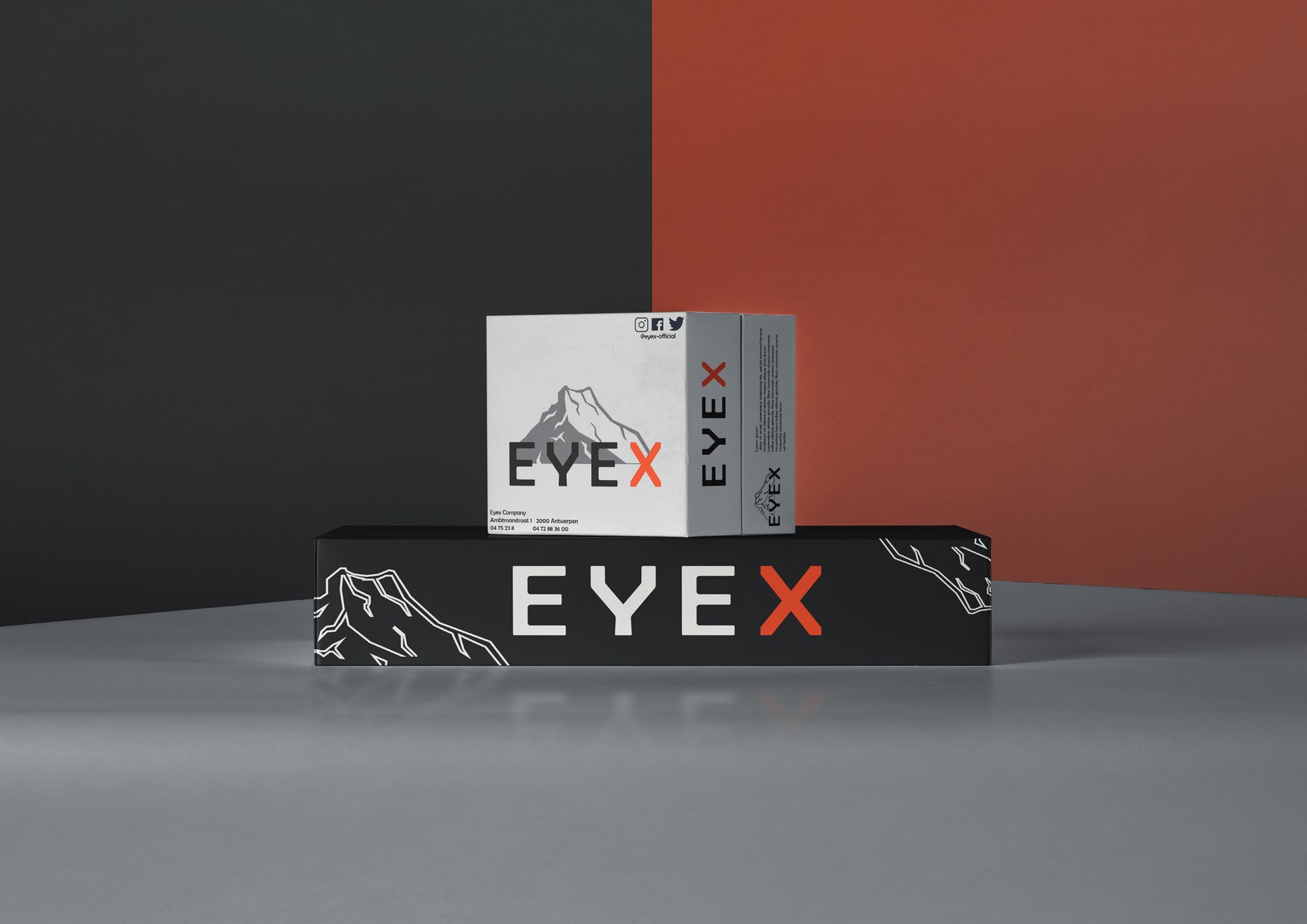 Eyex packaging mockup with mountain graphics and orange X accent.