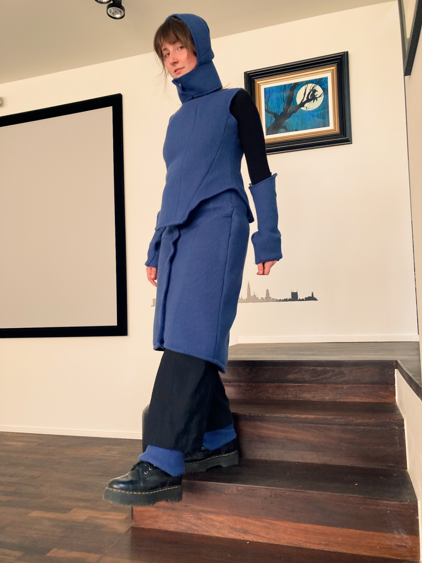 Charlotte on the stairs in the blue Hotcharlie outfit.