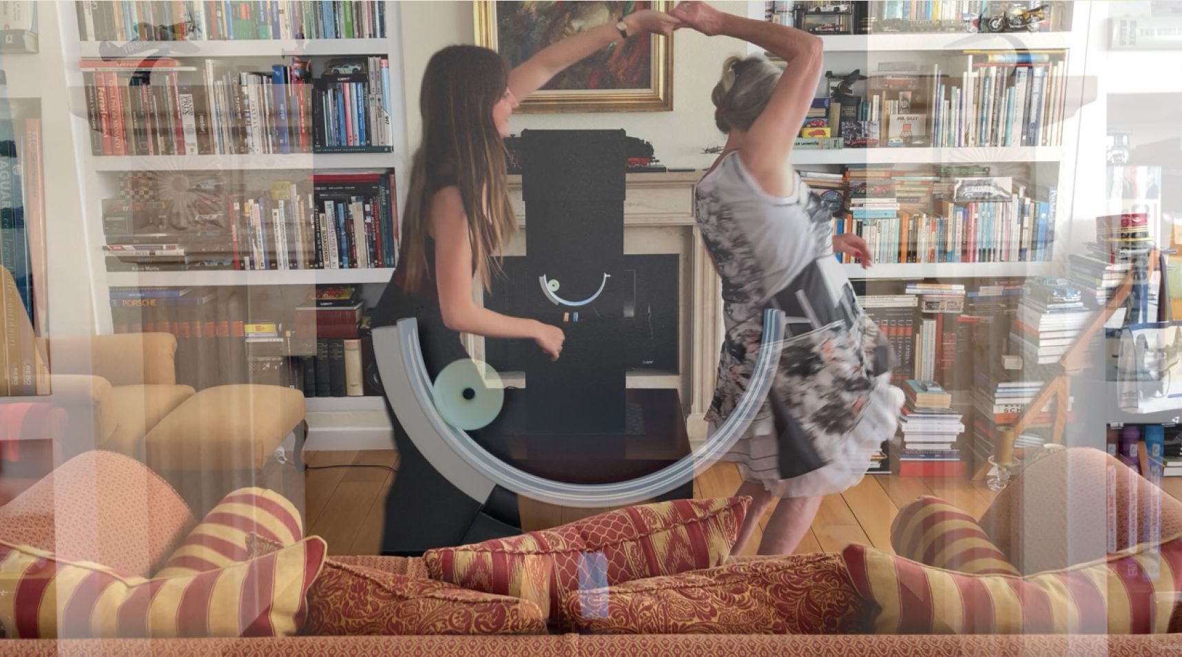 Two people dancing with the Musy jukebox.